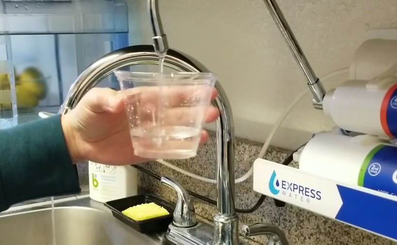 Filling glass from Express Water RO filter